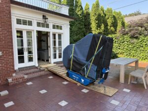 moving piano with tracked piano dolly 300x225